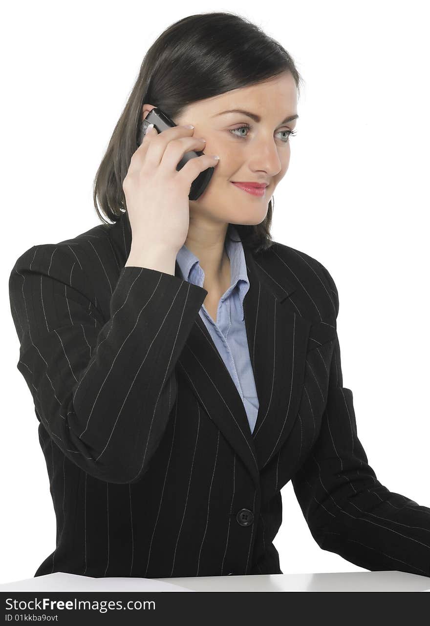 Beautiful businesswomen speaking with somebody by mobile phone