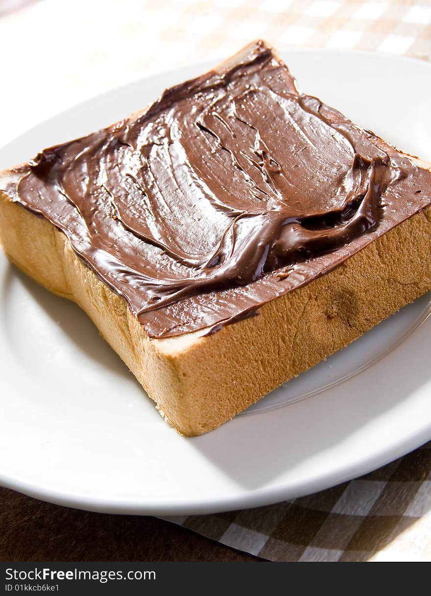 Toast with chocolate sauce on the table