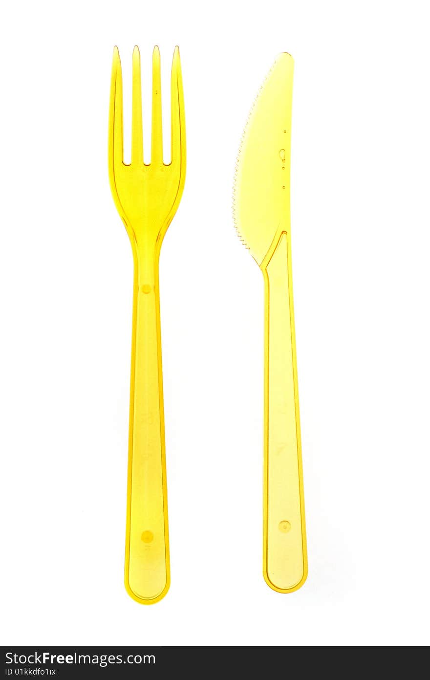 Yellow knife and fork isolated on white