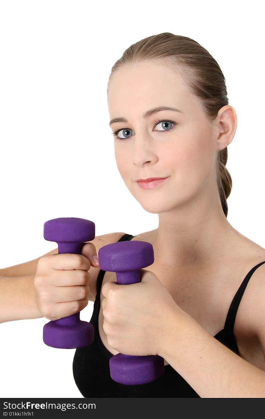 Young blonde exercising with light purple weights. Young blonde exercising with light purple weights