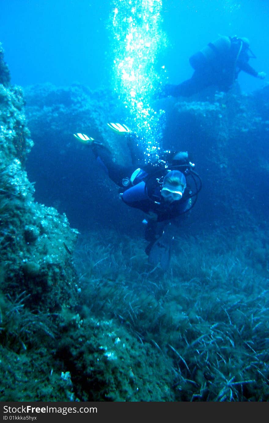 Divers underwater, picture shot under water. Divers underwater, picture shot under water