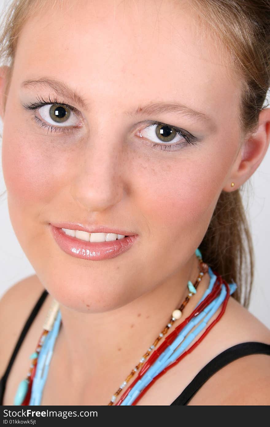 Close up of female teenager against a white background. Close up of female teenager against a white background