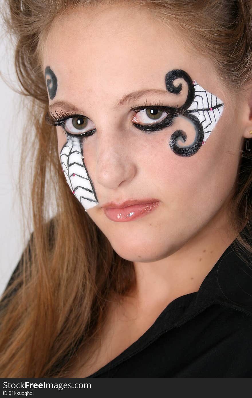 Close-up of Halloween teenager with face paint