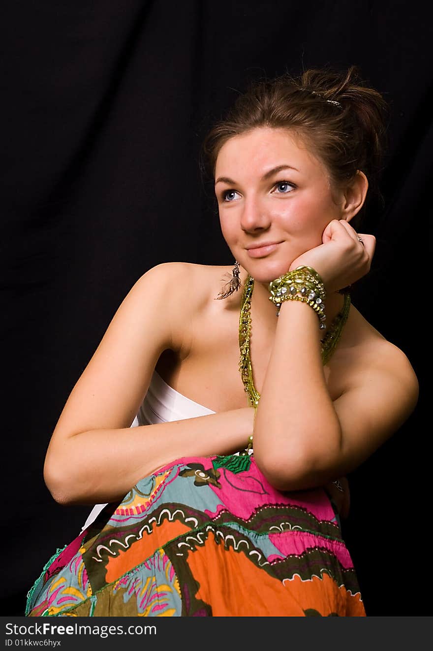 Nice young girl against a black background. Nice young girl against a black background