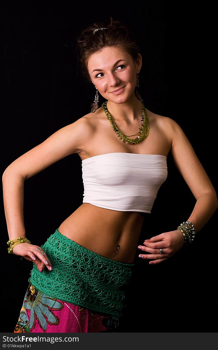 Nice young dancing girl against a black background. Nice young dancing girl against a black background