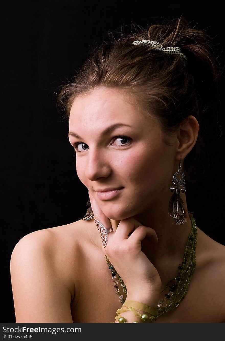 Nice young girl against a black background. Nice young girl against a black background