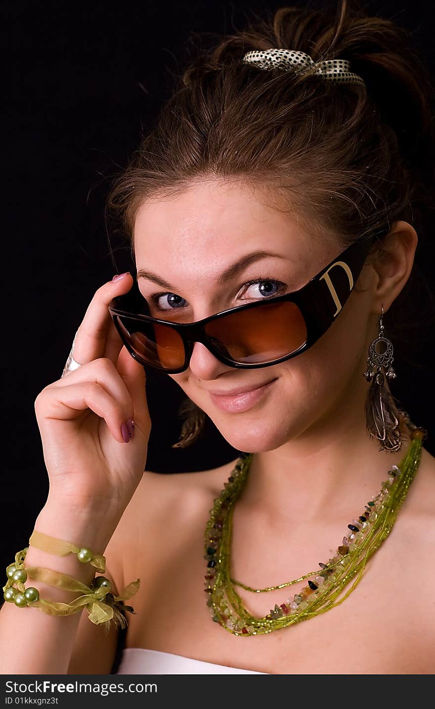 Nice young girl against a black background. Nice young girl against a black background