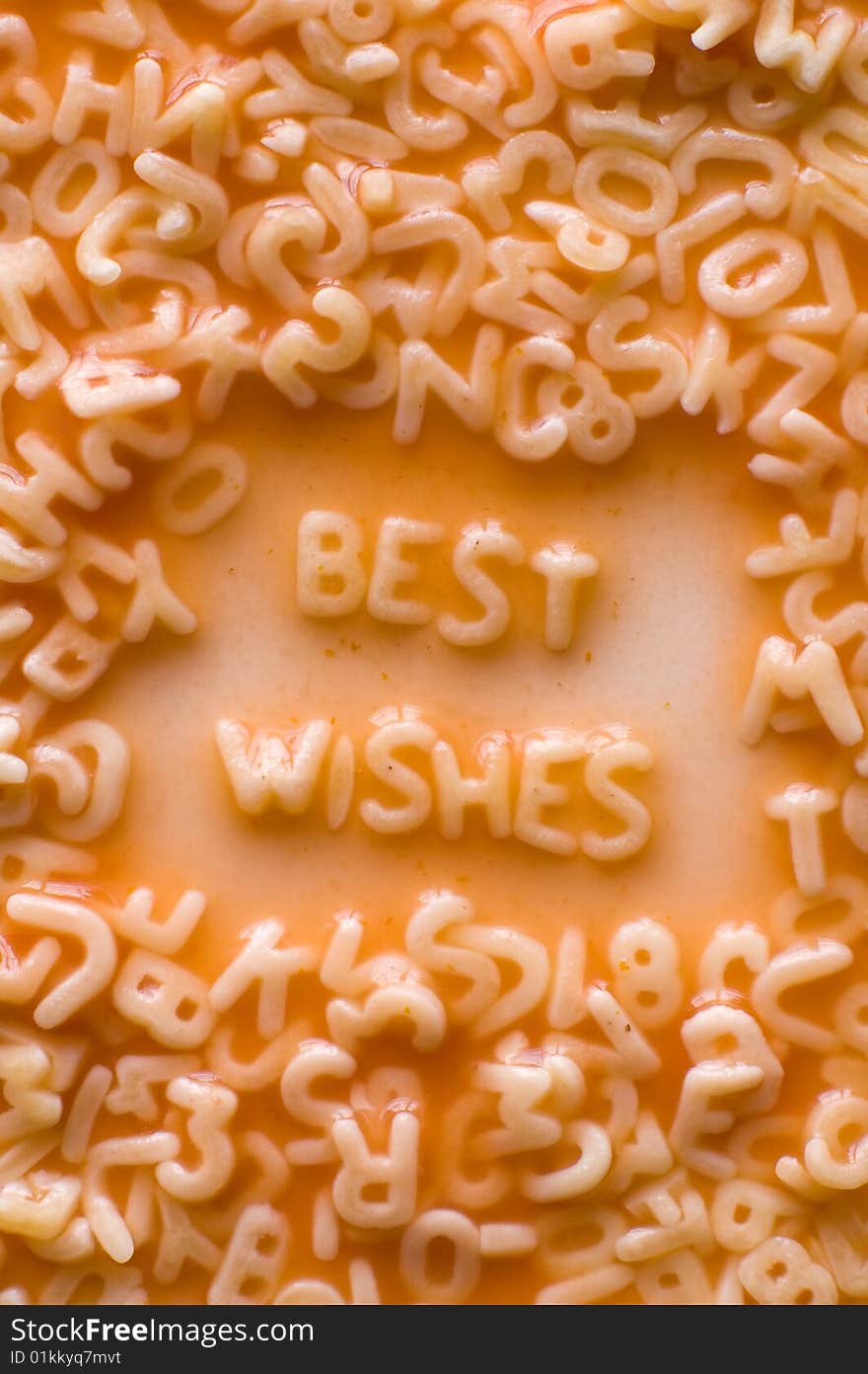 Best wishes text made of alphabet pastries, ketchup