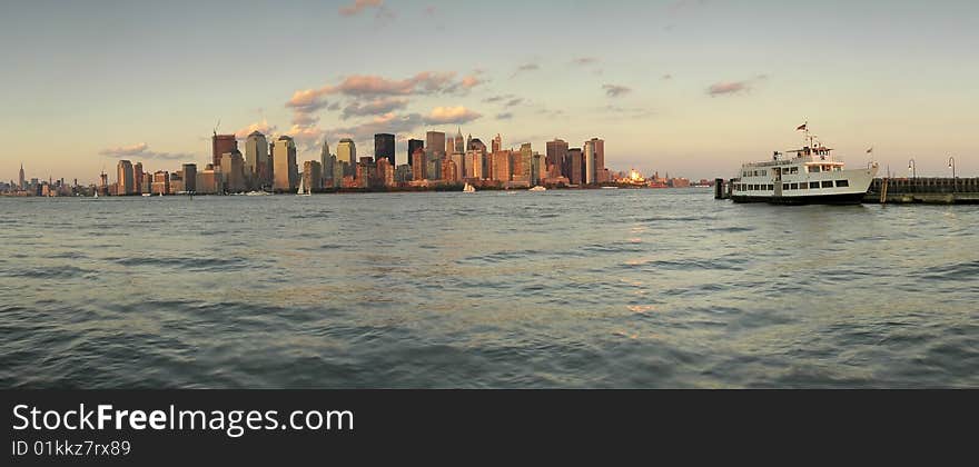 New york's manhattan panorama, photo taken from ellis island, white boat anchoring. New york's manhattan panorama, photo taken from ellis island, white boat anchoring