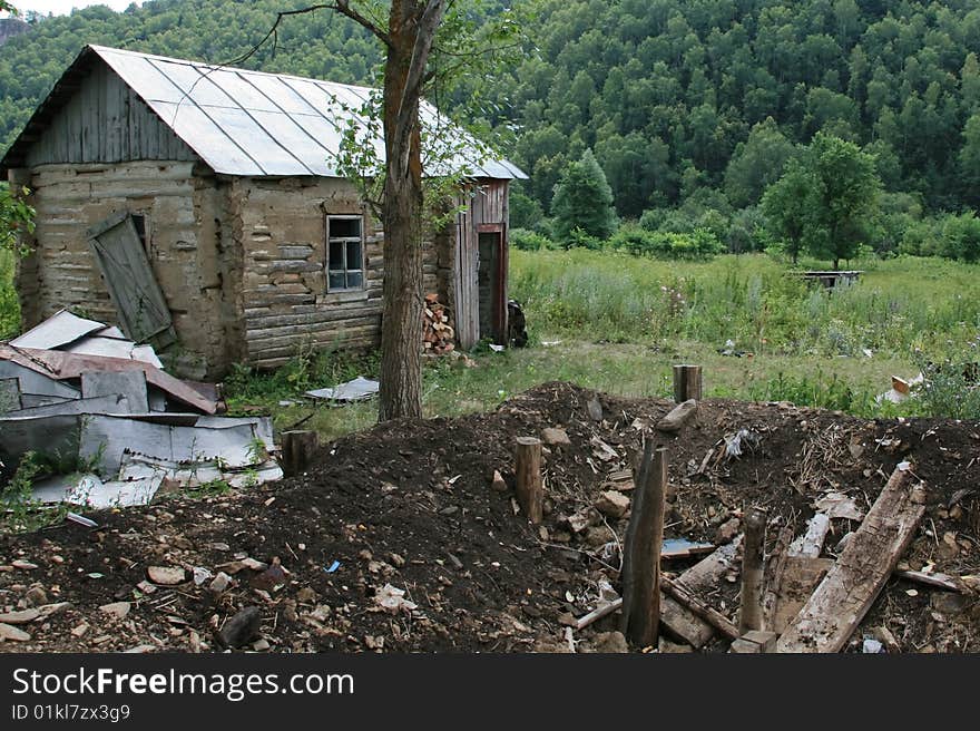 The wooden house near the forest. The wooden house near the forest