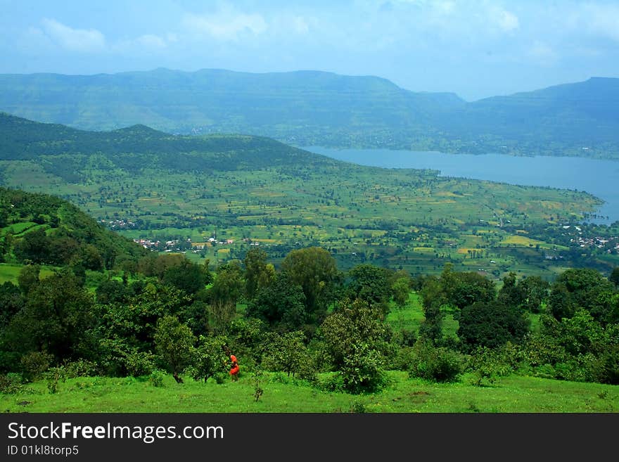 A beautiful landscape scene with river and mountains. A beautiful landscape scene with river and mountains.