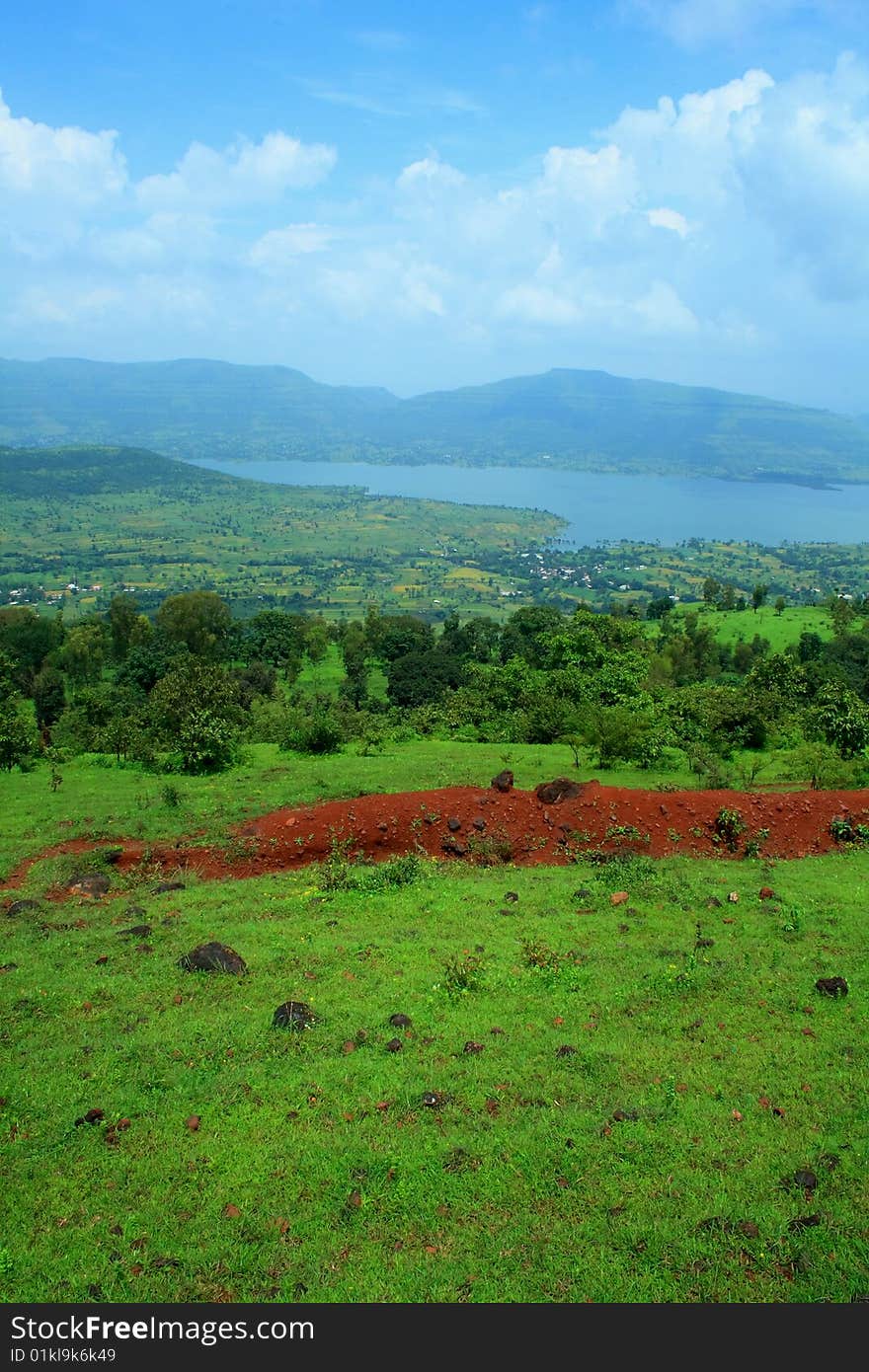 A beautiful landscape scene with river and mountains. A beautiful landscape scene with river and mountains.