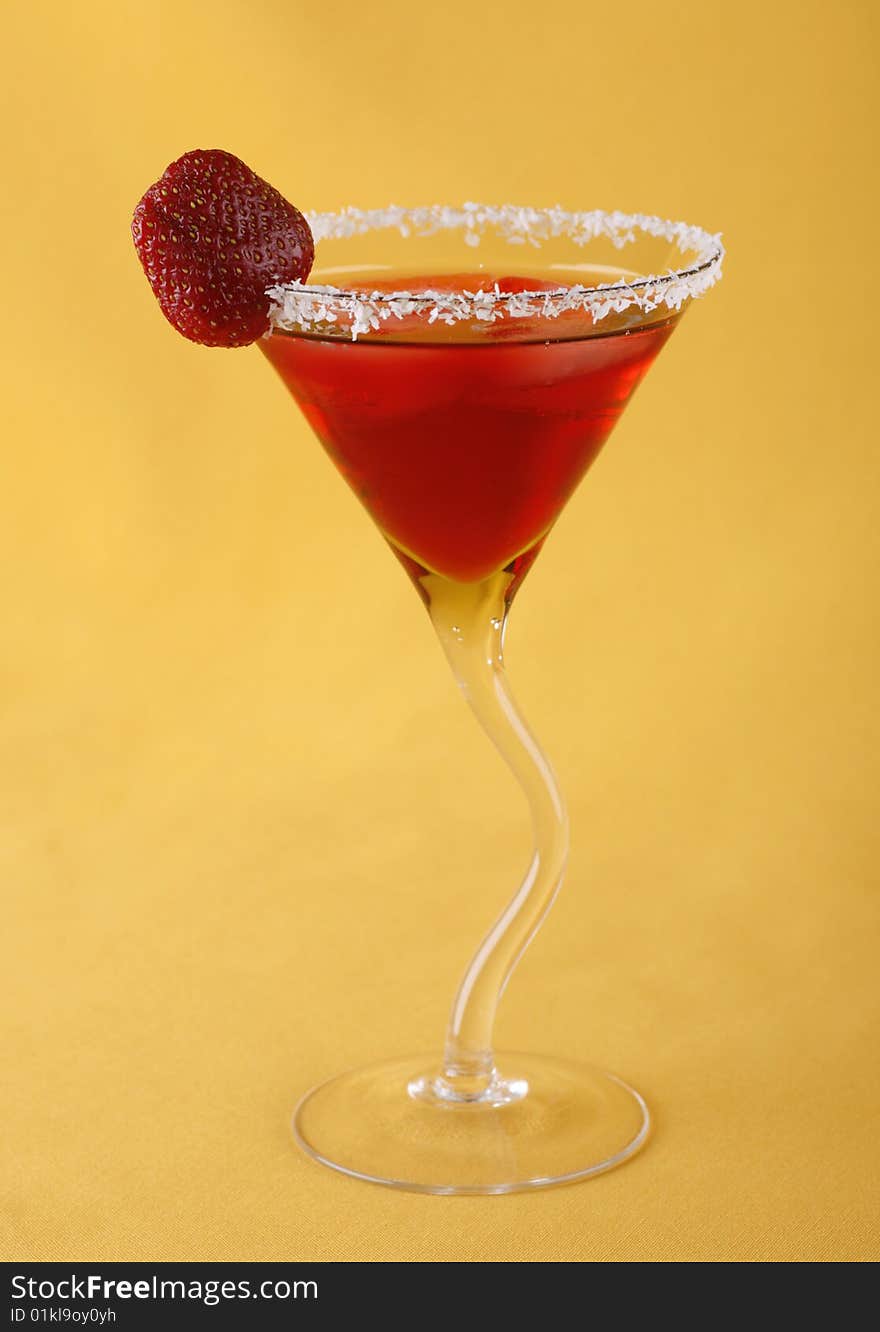 Alcoholic cocktail with strawberry liquor background the yellow. Alcoholic cocktail with strawberry liquor background the yellow