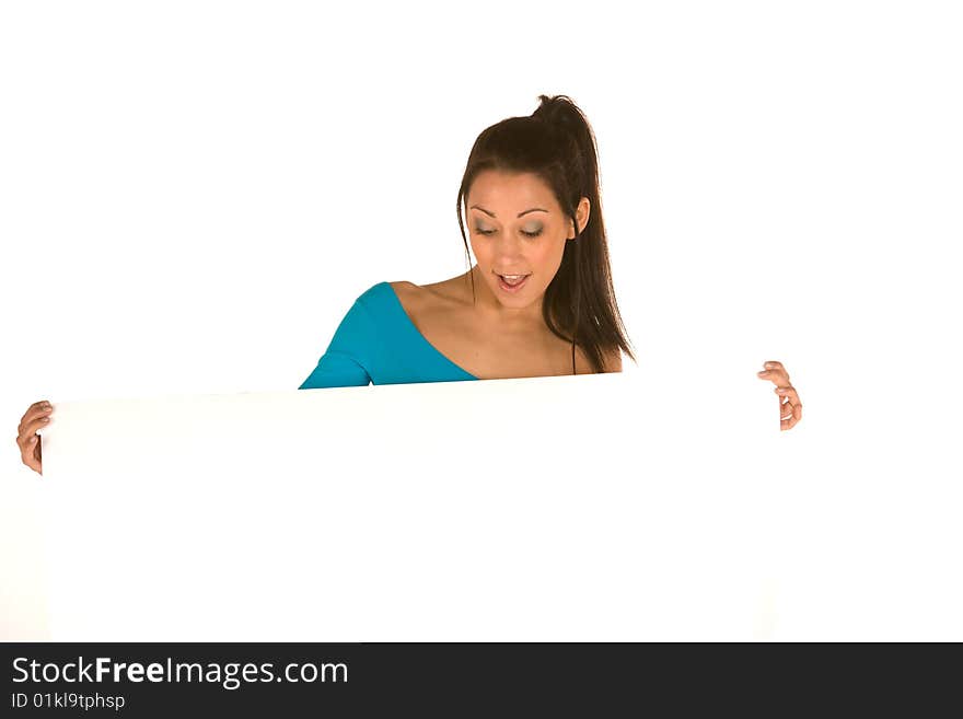 Young caucasian brunette holding a blank panel with surprised facial expression isolated on white,wearing casual clothes.Concept of advertising. Young caucasian brunette holding a blank panel with surprised facial expression isolated on white,wearing casual clothes.Concept of advertising