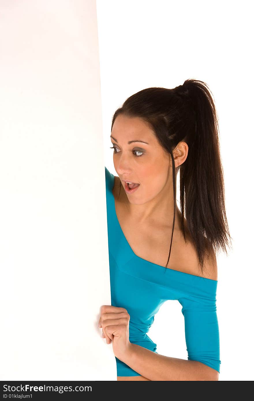 Young caucasian brunette holding a blank panel with surprised facial expression isolated on white,wearing casual clothes.Concept of advertising. Young caucasian brunette holding a blank panel with surprised facial expression isolated on white,wearing casual clothes.Concept of advertising