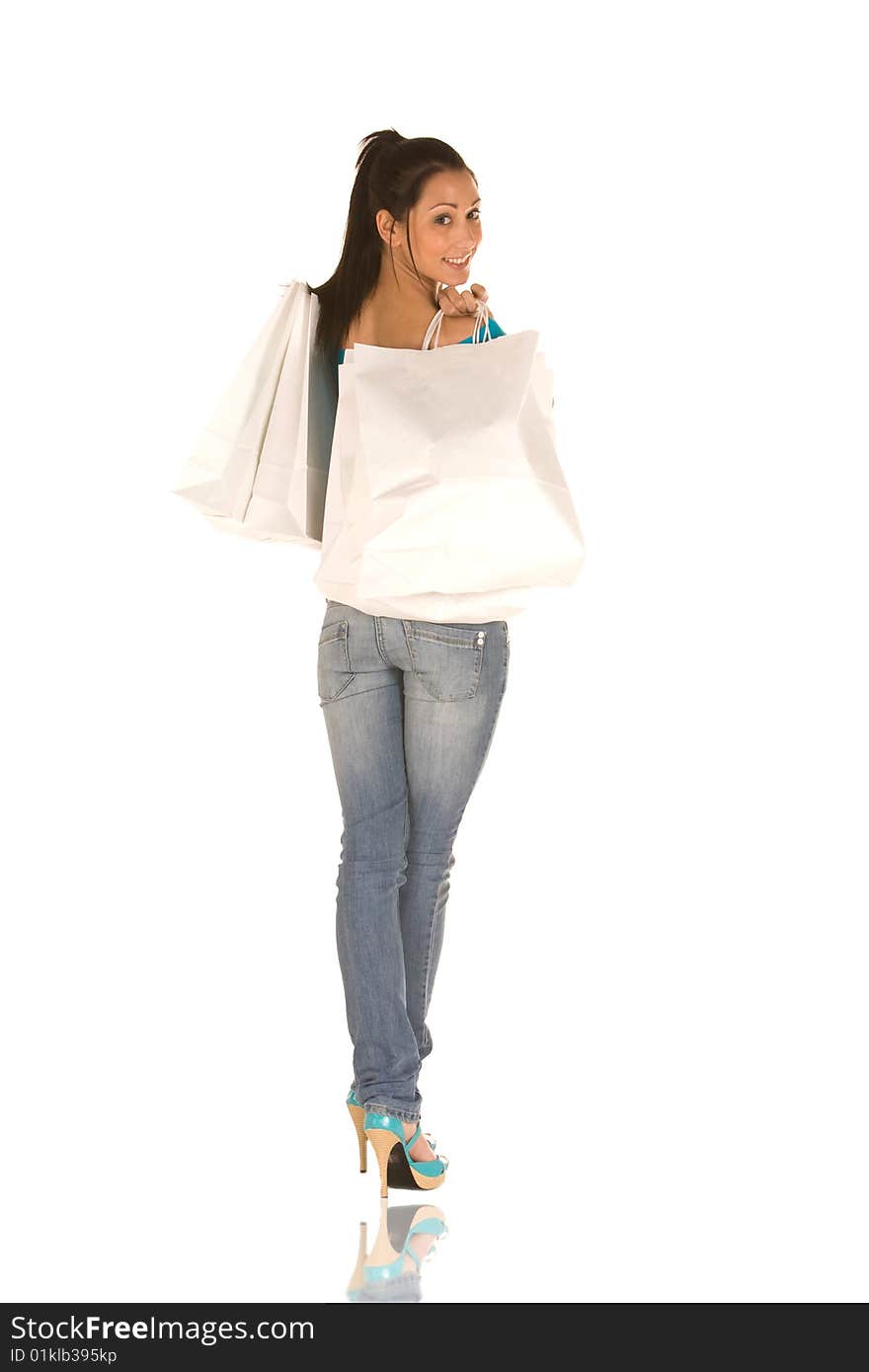 Young caucasian brunette with a bunch of white shopping bags,isolated on white,with happy expression. Young caucasian brunette with a bunch of white shopping bags,isolated on white,with happy expression.