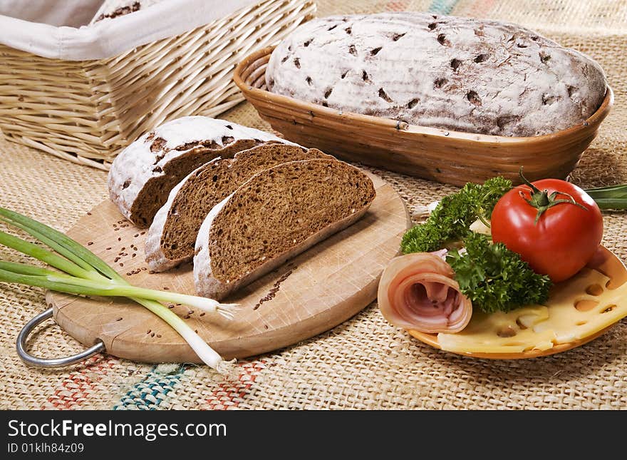 Composition with bread and vegetables. Composition with bread and vegetables.