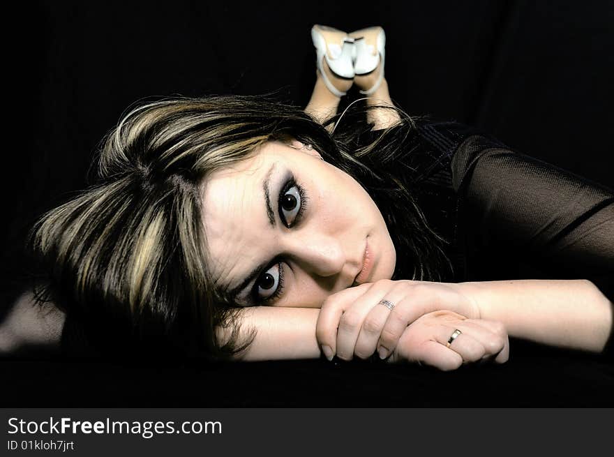 Studio Shot of a brunette woman with big brown eyes, isolated on white background. Studio Shot of a brunette woman with big brown eyes, isolated on white background