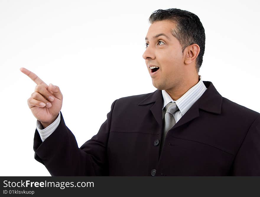 Portrait of businessman pointing aside with white background