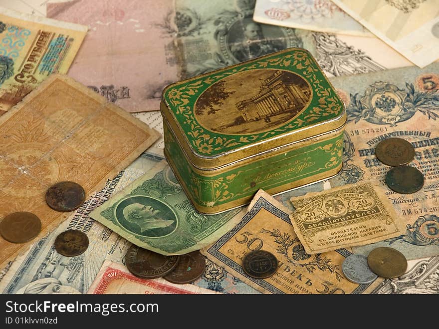 Background with old currency and box