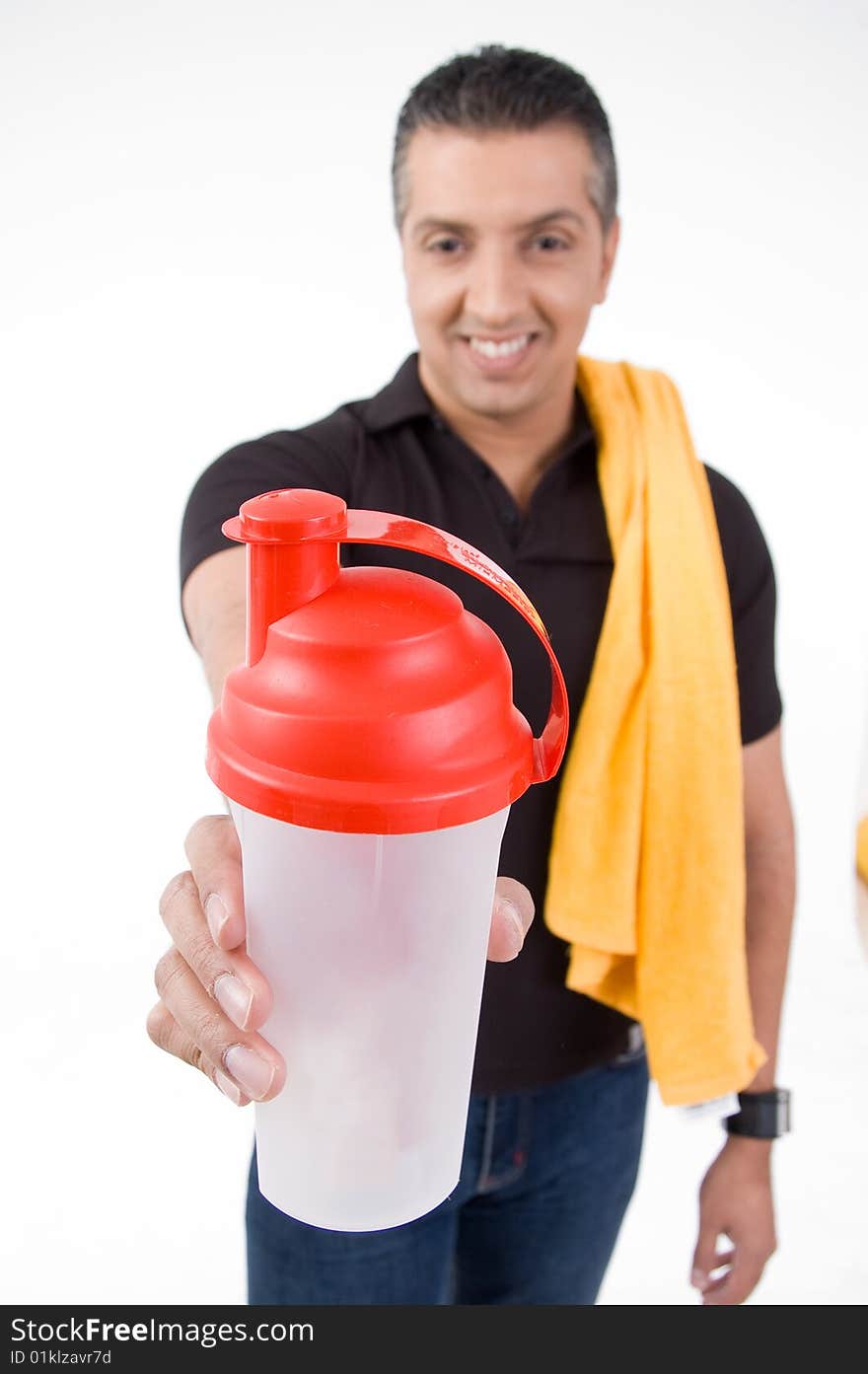 Front view of smiling man offering water bottle with white background