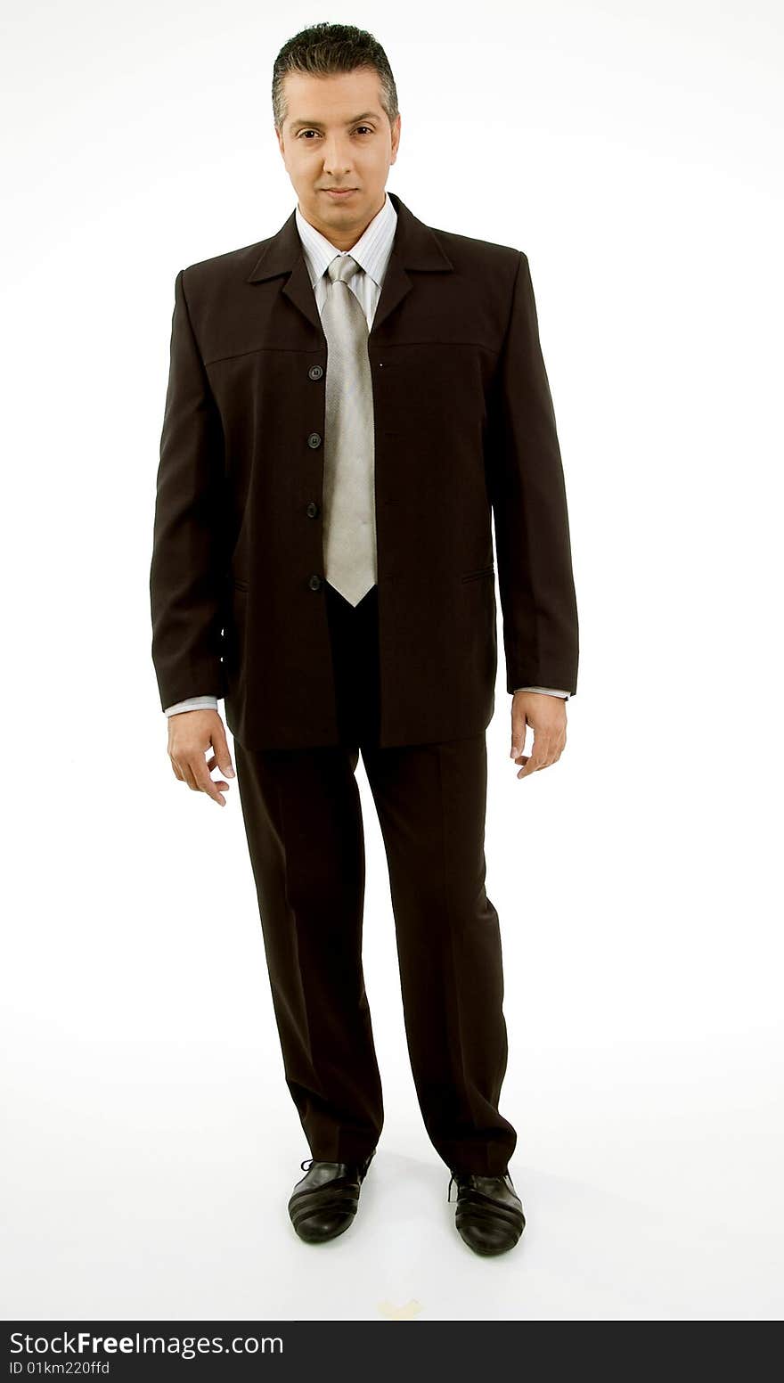 Front view of standing adult boss looking at camera with white background