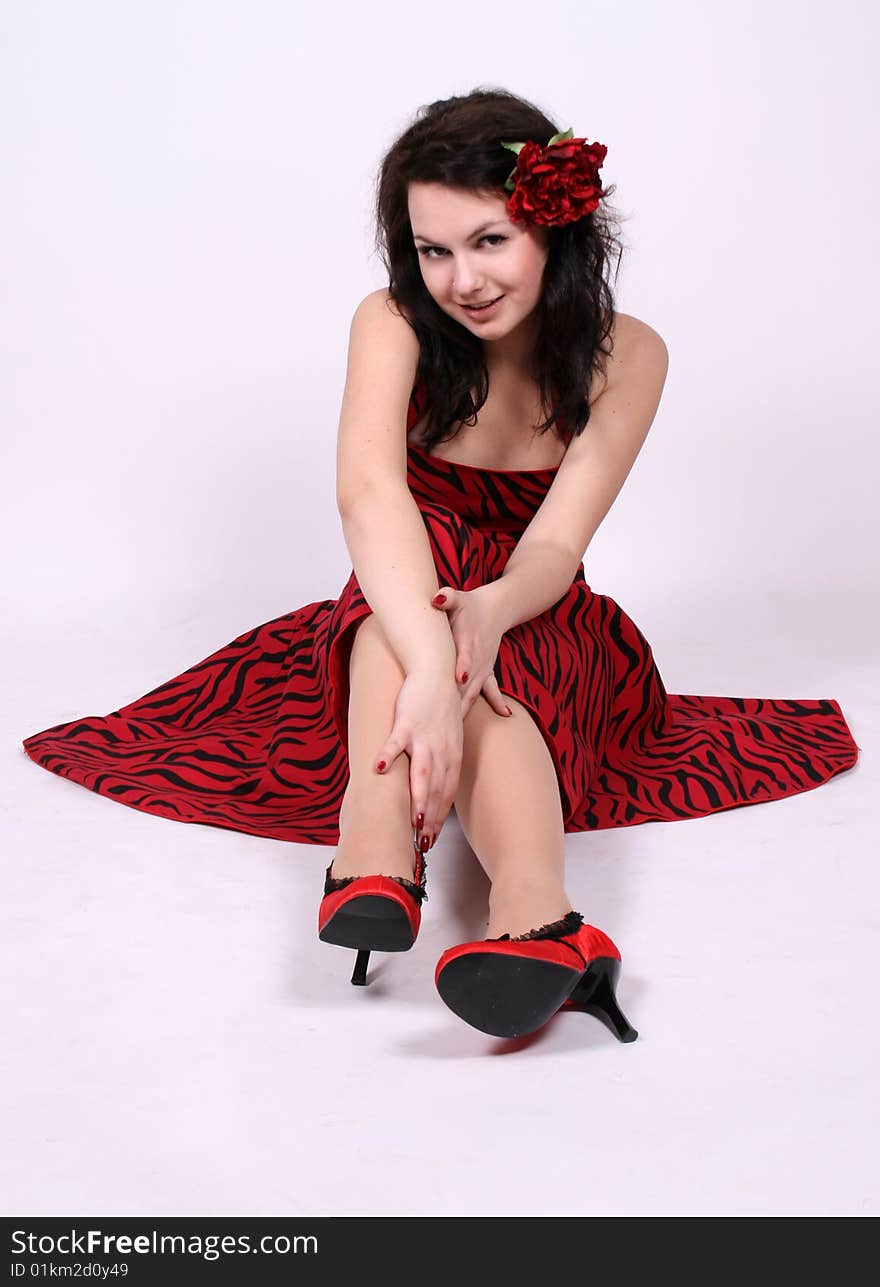 Seductive pinup girl sitting in studio