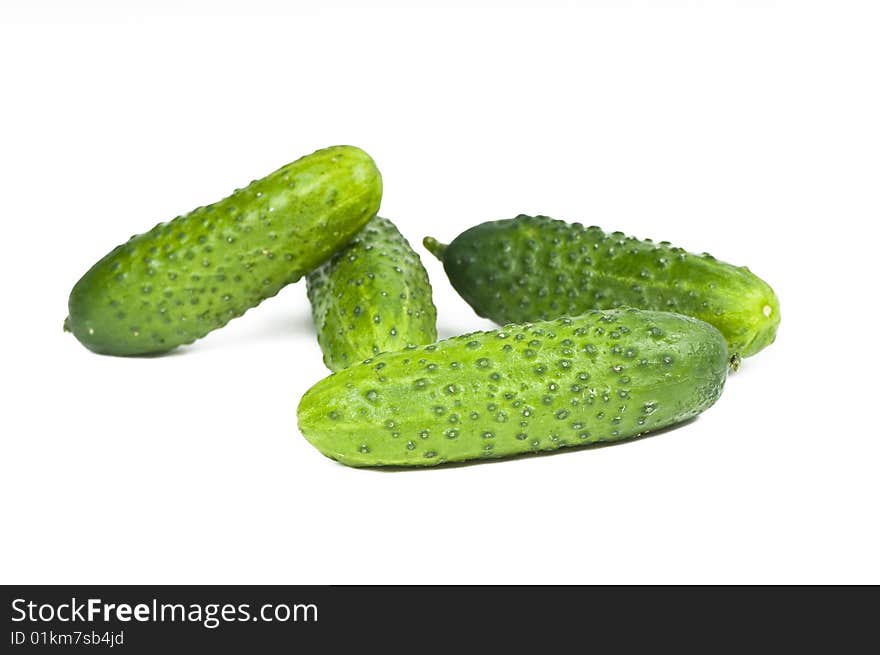 Green cucumber vegetable fruits isolated on white background