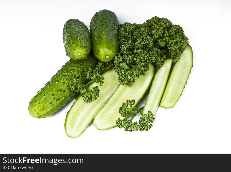 Cutted And Whole Cucumbers With Parsley