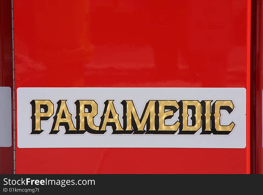 View of paramedic writing on red fire fighter truck