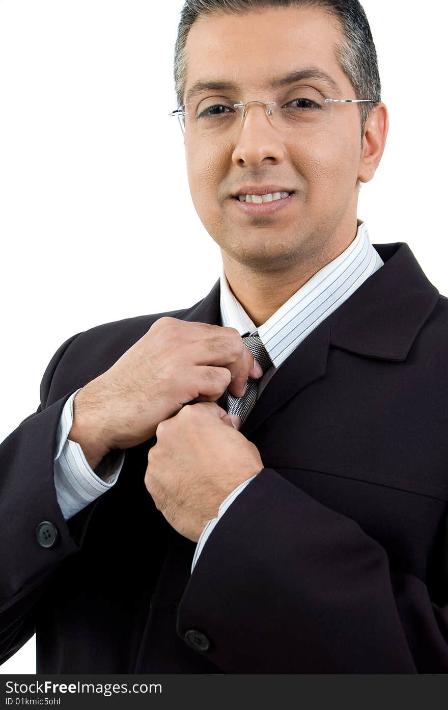 Portrait of CEO holding his tie on an isolated white background