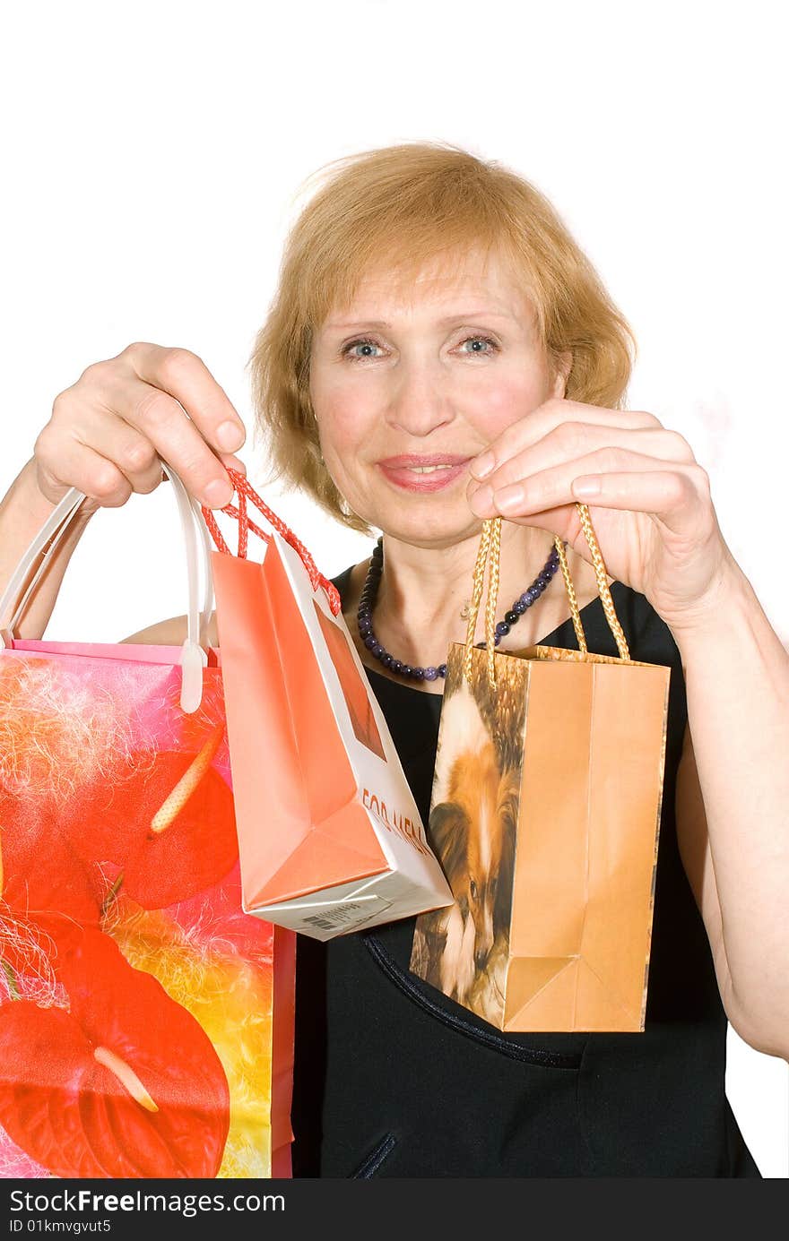 Woman with packages is insulated on white background. Woman with packages is insulated on white background