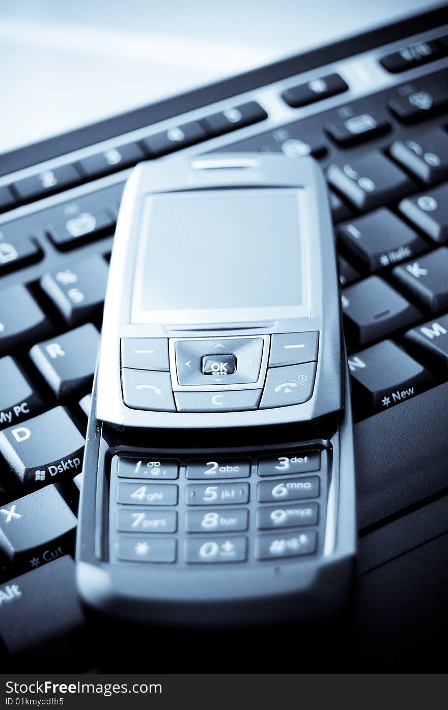 Detail shot of Mobile Phone and Laptop Keyboard. Detail shot of Mobile Phone and Laptop Keyboard