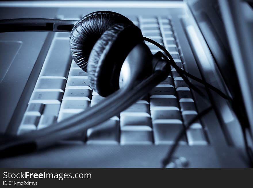 Close up of keyboard and headphones