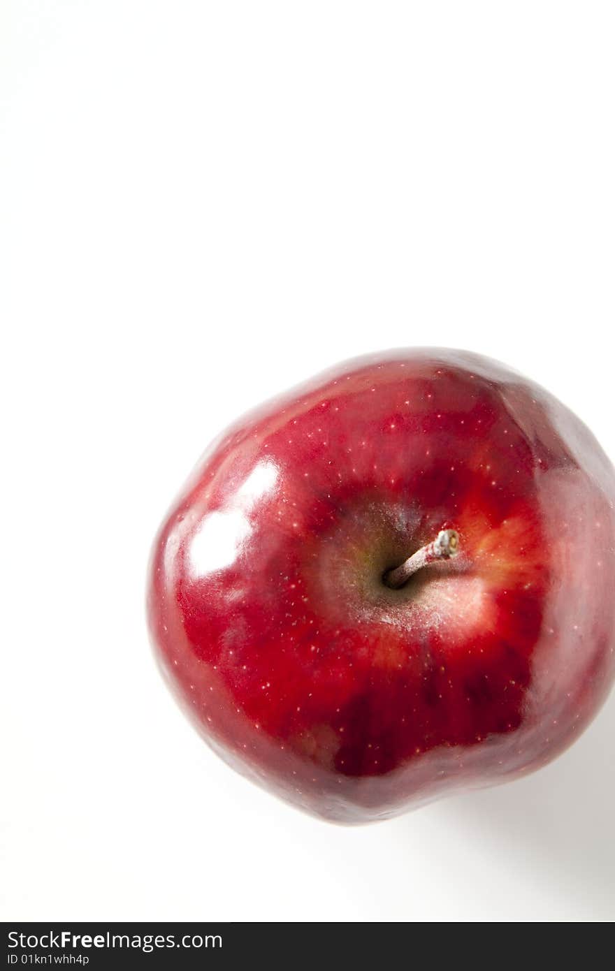 A single red apple isolated on white. A single red apple isolated on white.