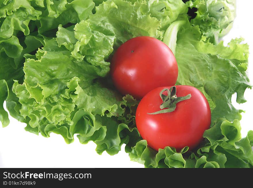 Fresh salad and two tomatoes.