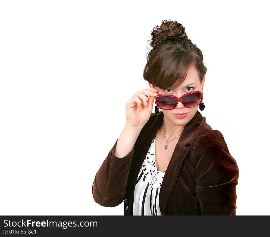 One attractive adult twenties woman looking over her sunglasses over white. One attractive adult twenties woman looking over her sunglasses over white