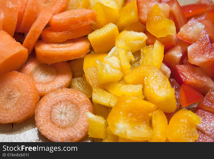 Fresh vegetables choped on the table. Fresh vegetables choped on the table