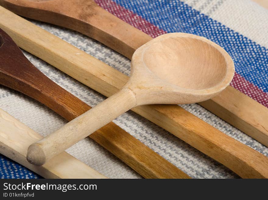 Macro wooden spoon on a colour sacking. Macro wooden spoon on a colour sacking