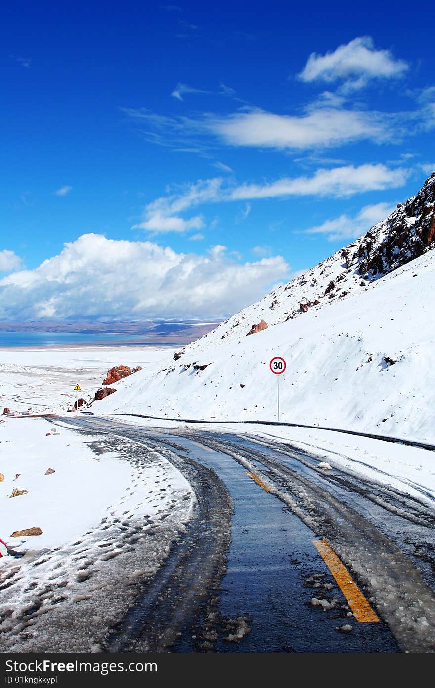 The road to Namtso Lake in the snow of morning.