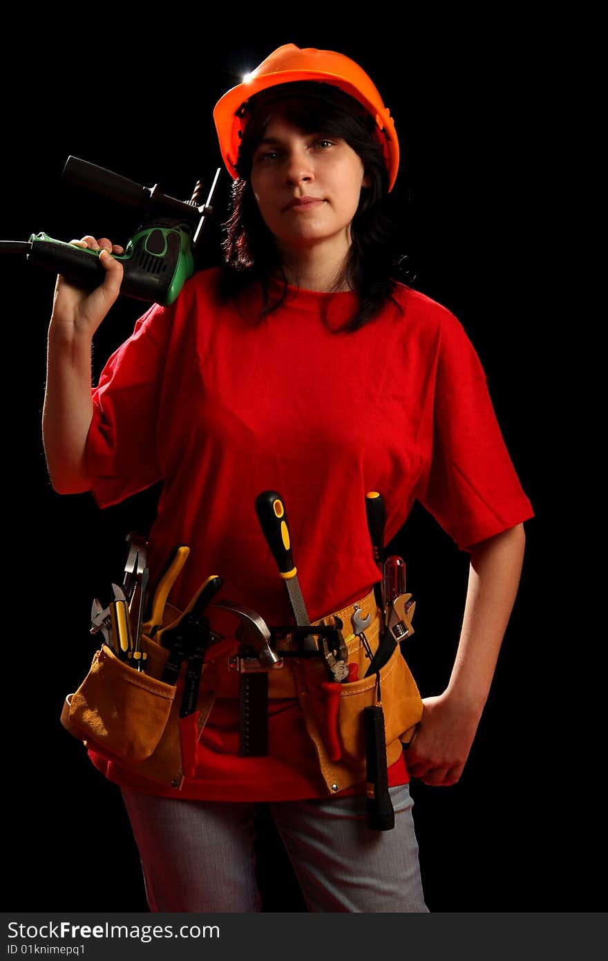 Young woman with work tools and drill