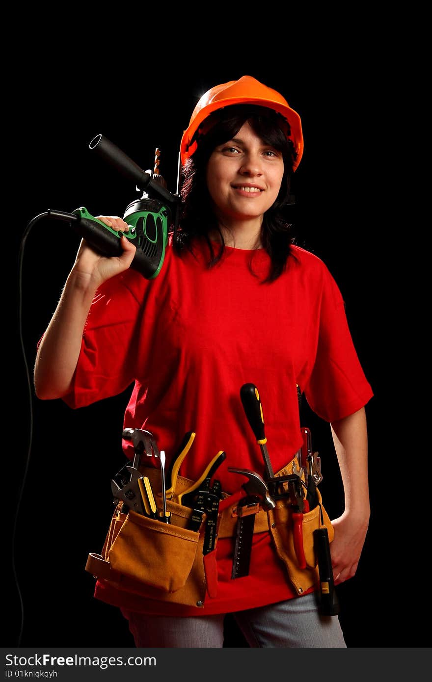 Young woman with work tools, isolated on black. Young woman with work tools, isolated on black