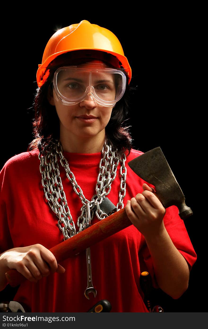 Young woman with chain and axe, isolated on black