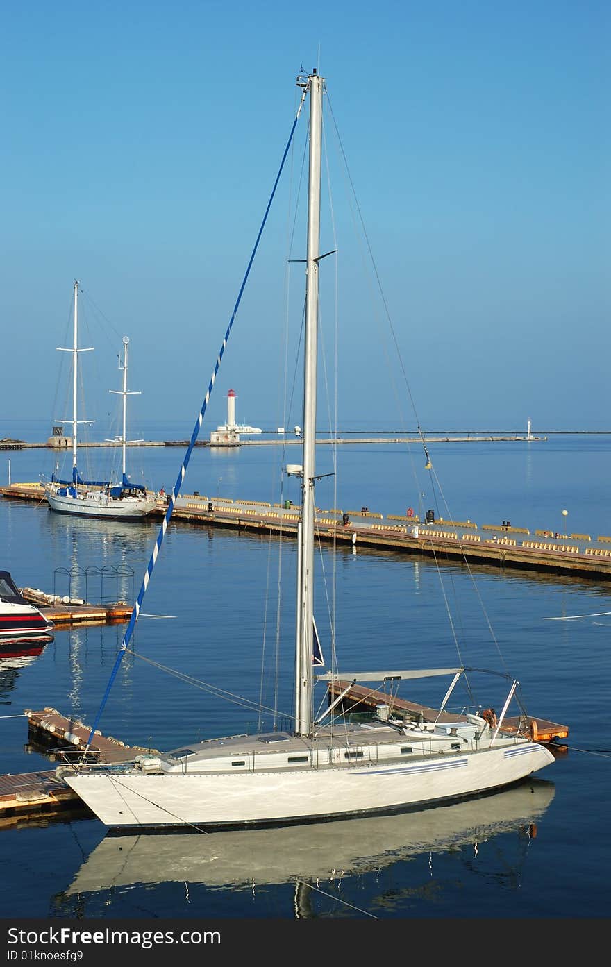 White yacht docked in a sea port