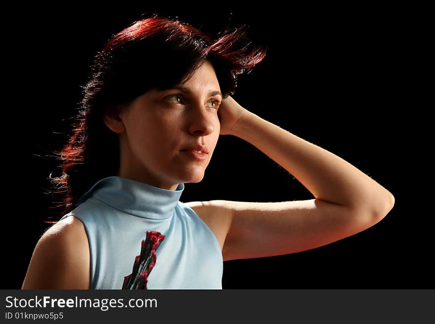 Young woman with spanish fan, isolated on black