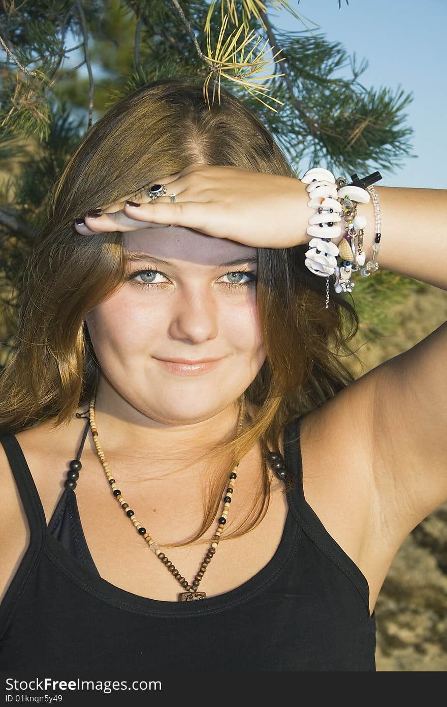 Young woman with shielding eyes. Young woman with shielding eyes