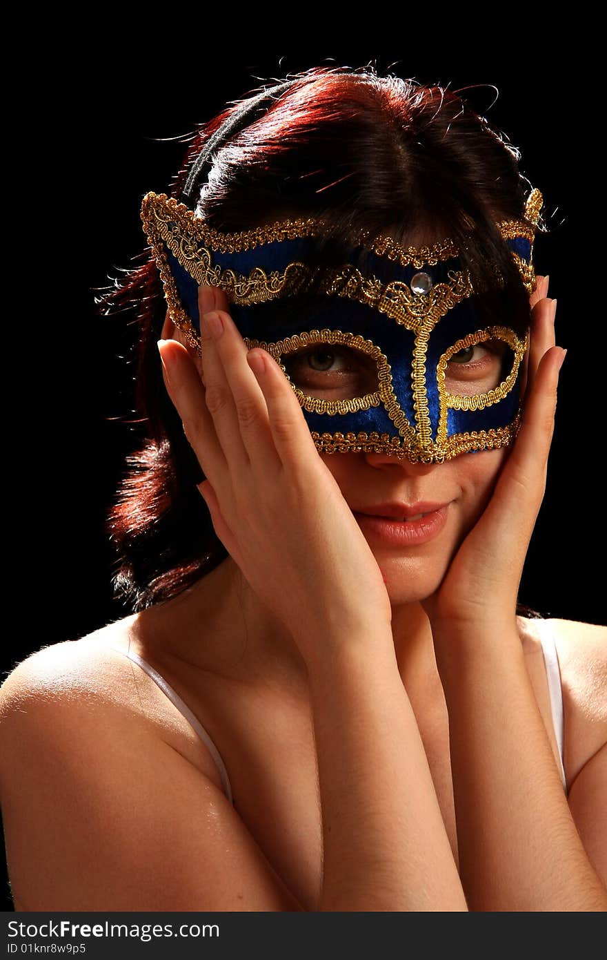 Young brunette with venetian mask