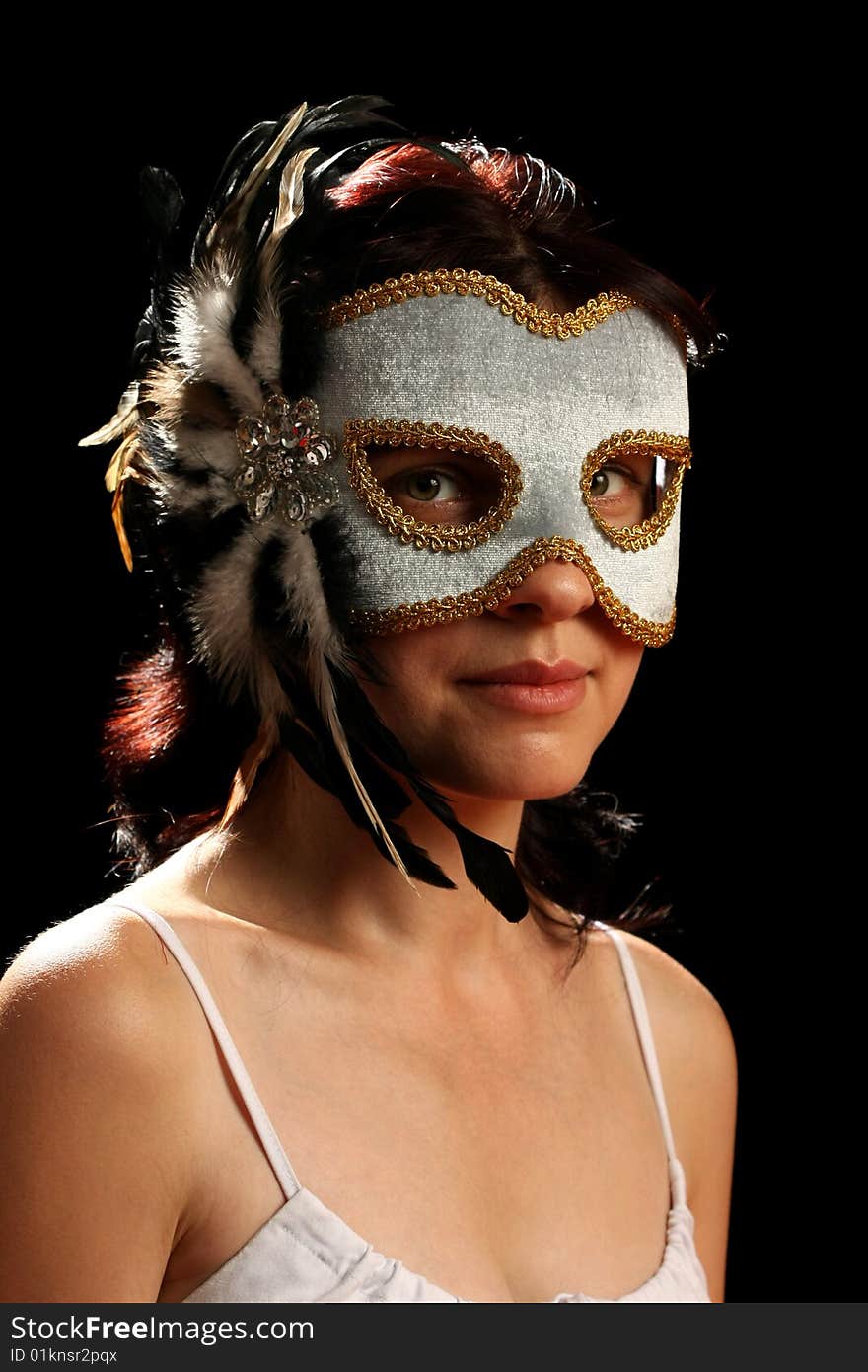 Young brunette with venetian mask