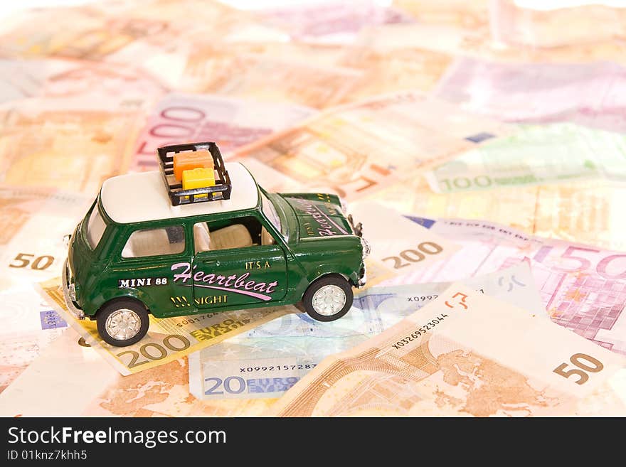 Toy-car placed on lots of banknotes. Toy-car placed on lots of banknotes