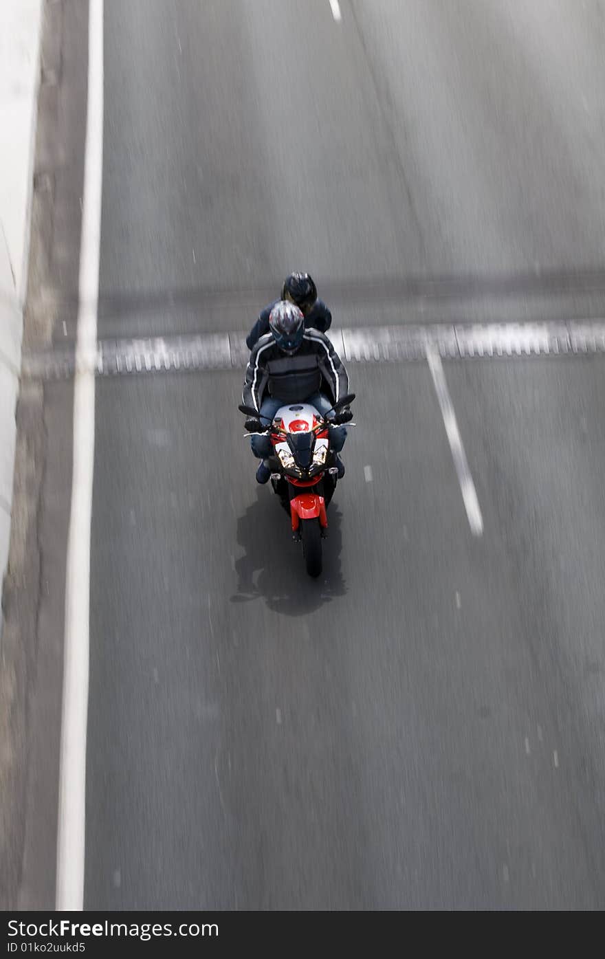 Motorbike speeding down road